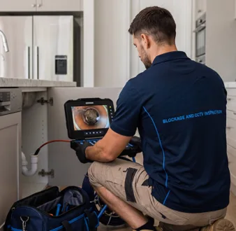 Clearing a blocked sink at a Bringelly property